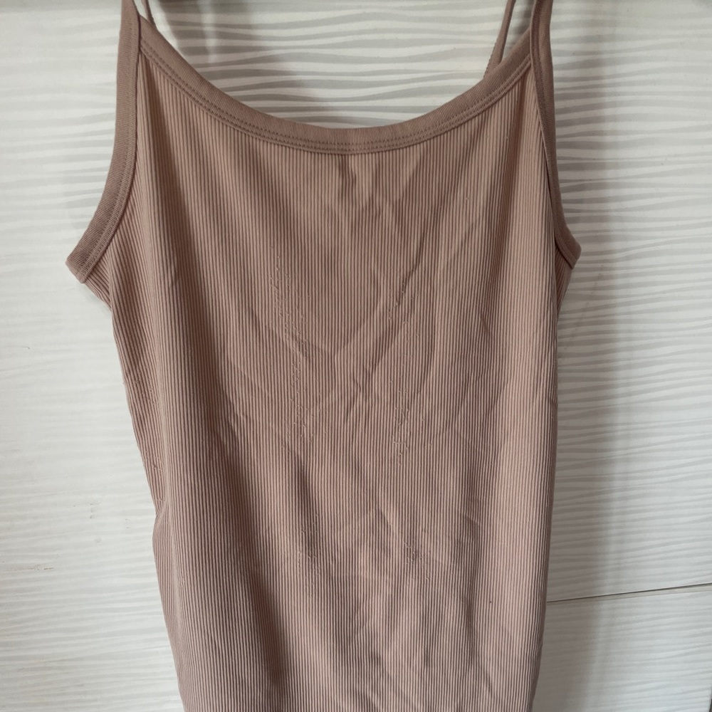 Form fitting nude tank